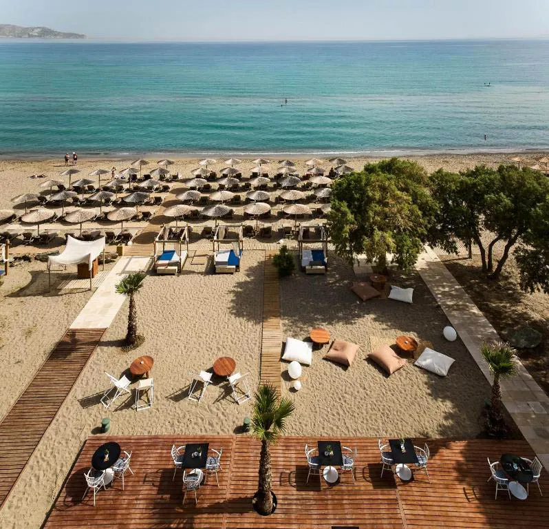 Organised beach area with sunbeds at Ammoudara Beach in Crete