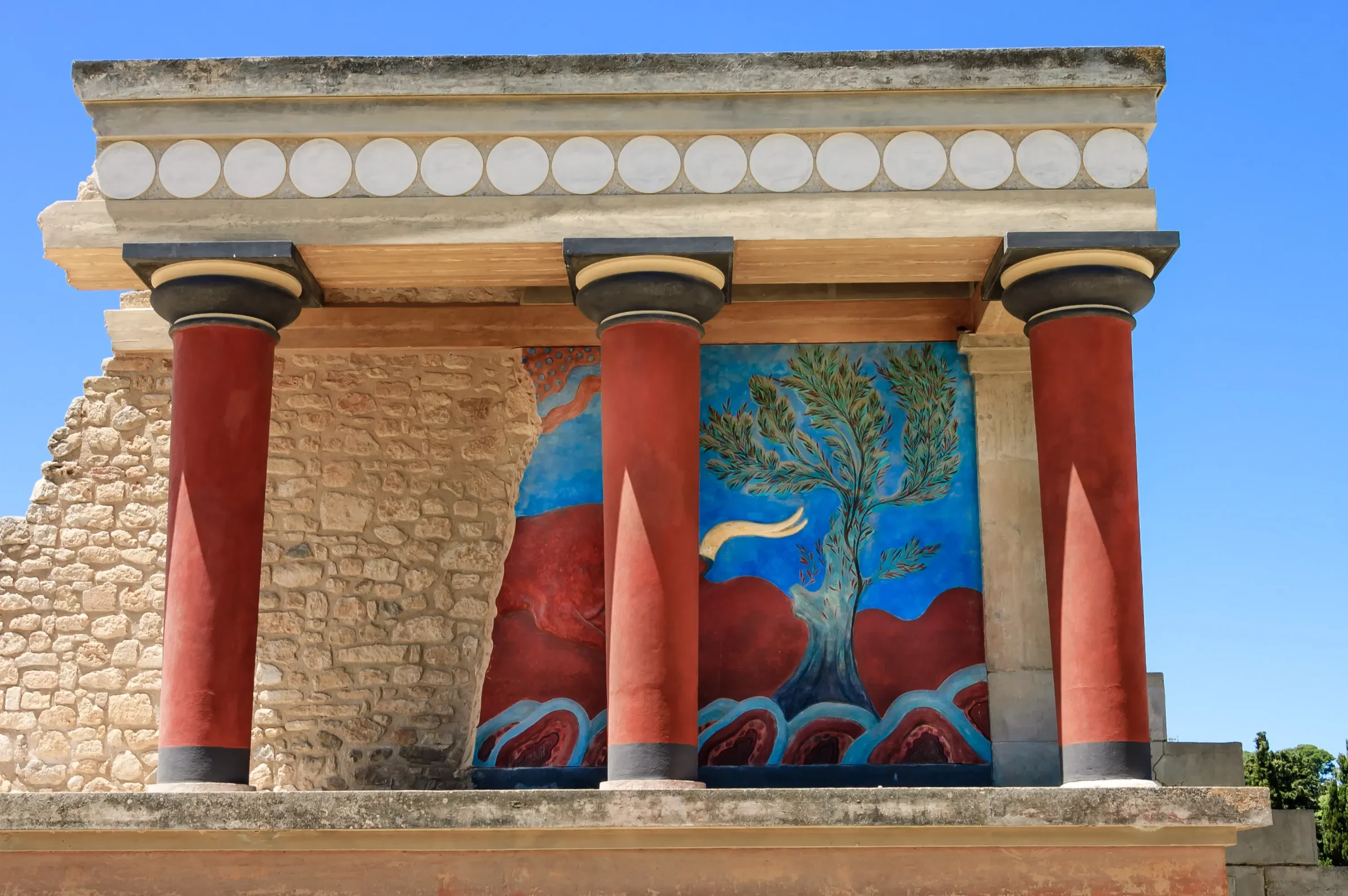 The central court of Knossos looking south, with the west wing and the hills of central Crete beyond.
