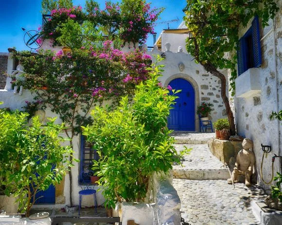 Stone lane in Kritsa village Crete with traditional houses and hillside views