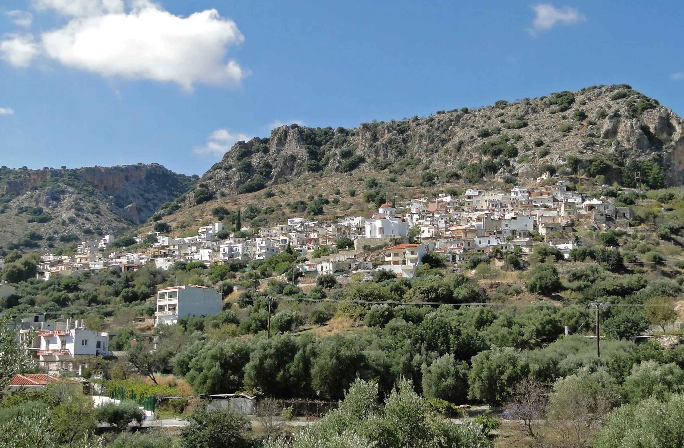 Kritsa village Crete with whitewashed houses and mountain landscape, Lasithi