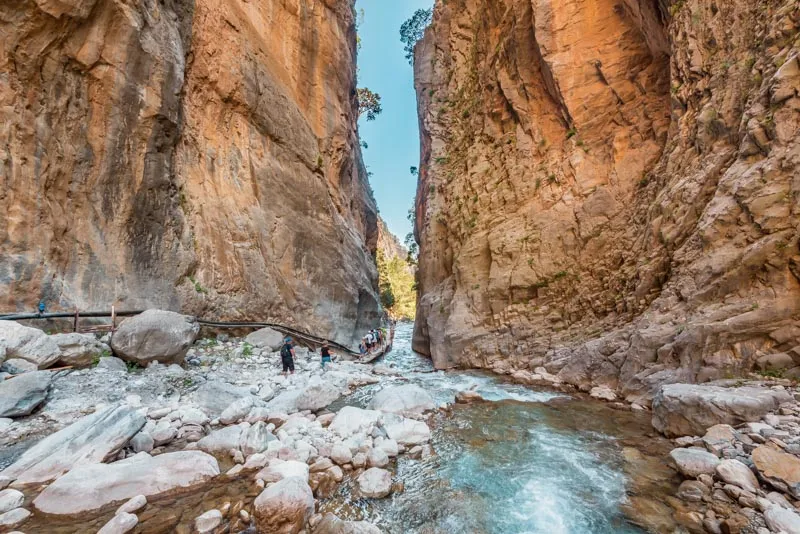 Looking up from the floor of Samaria Gorge toward the narrow strip of sky between the high rock walls, western Crete.